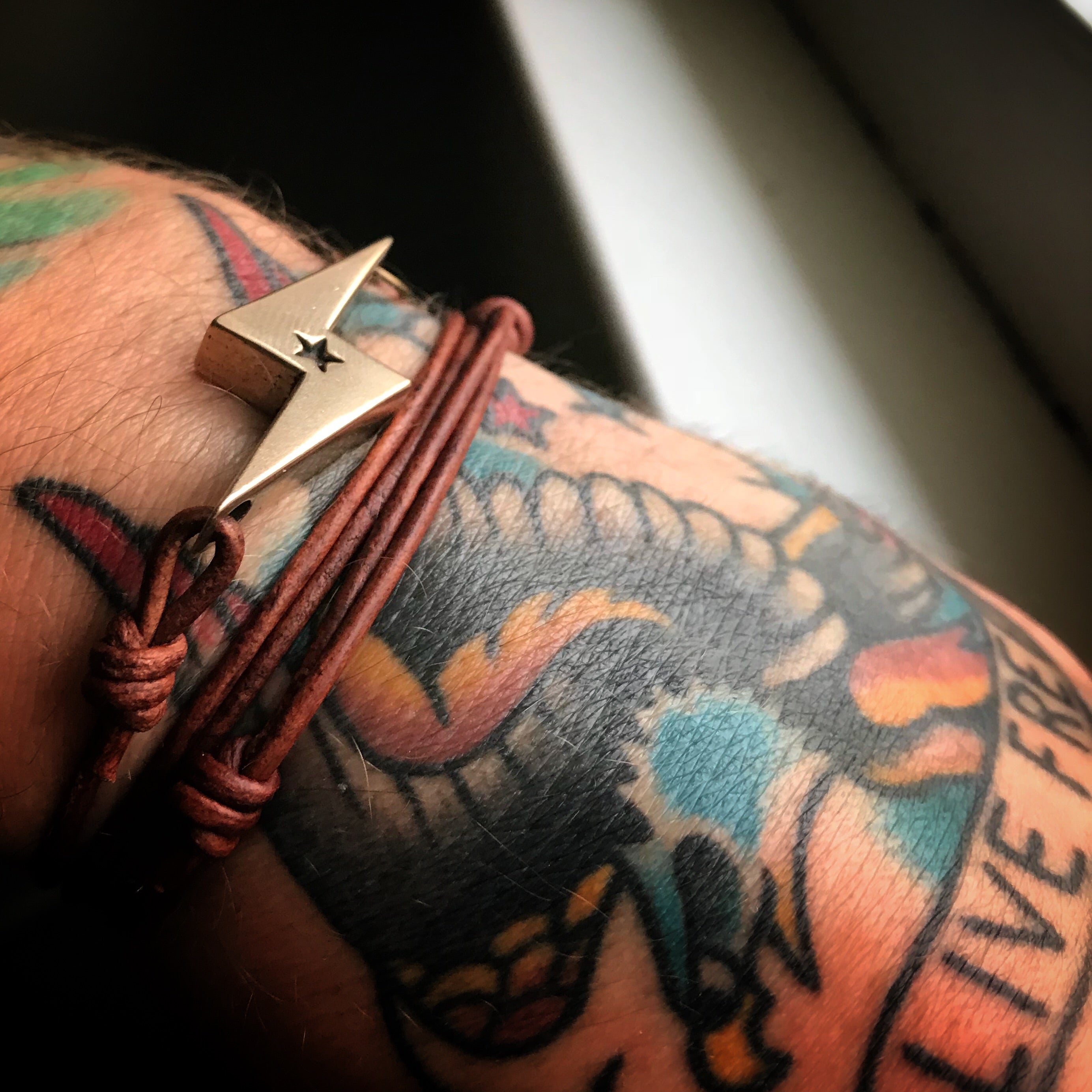 STRENGTH Lightning Bolt Bracelet - Bronze on Leather Cord